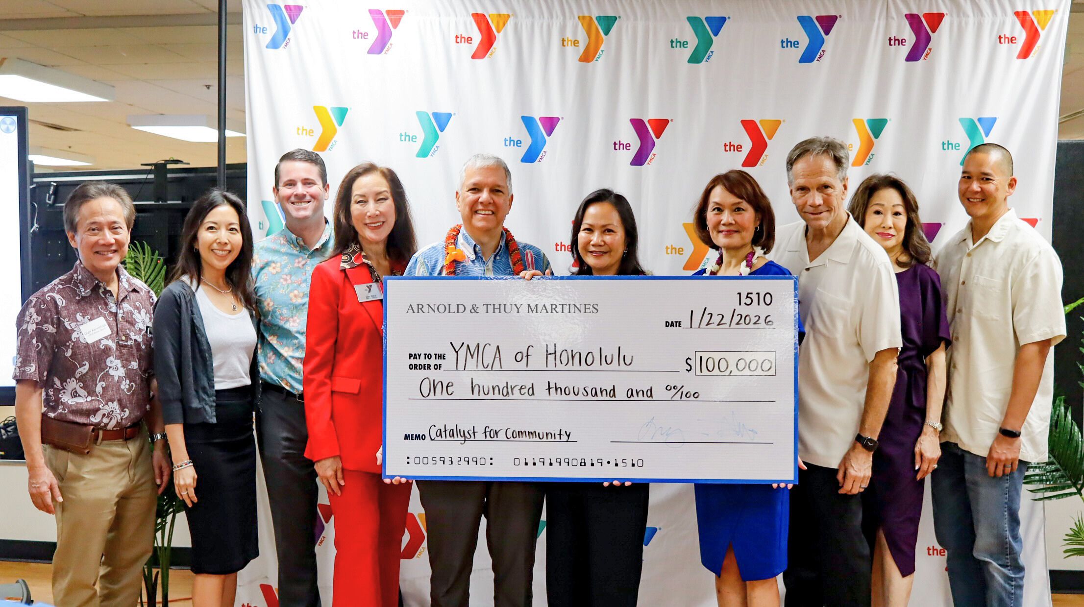 Community partners gather for a check presentation commemorating a combined $425,000 contribution from the Central Pacific Bank Foundation, Federal Home Loan Bank of Des Moines, and Arnold and Thuy Martines to the YMCA of Honolulu.