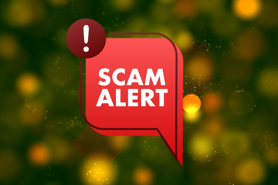 Red "Scam Alert" notification graphic with an exclamation mark icon on a blurred green background, representing fraud awareness.