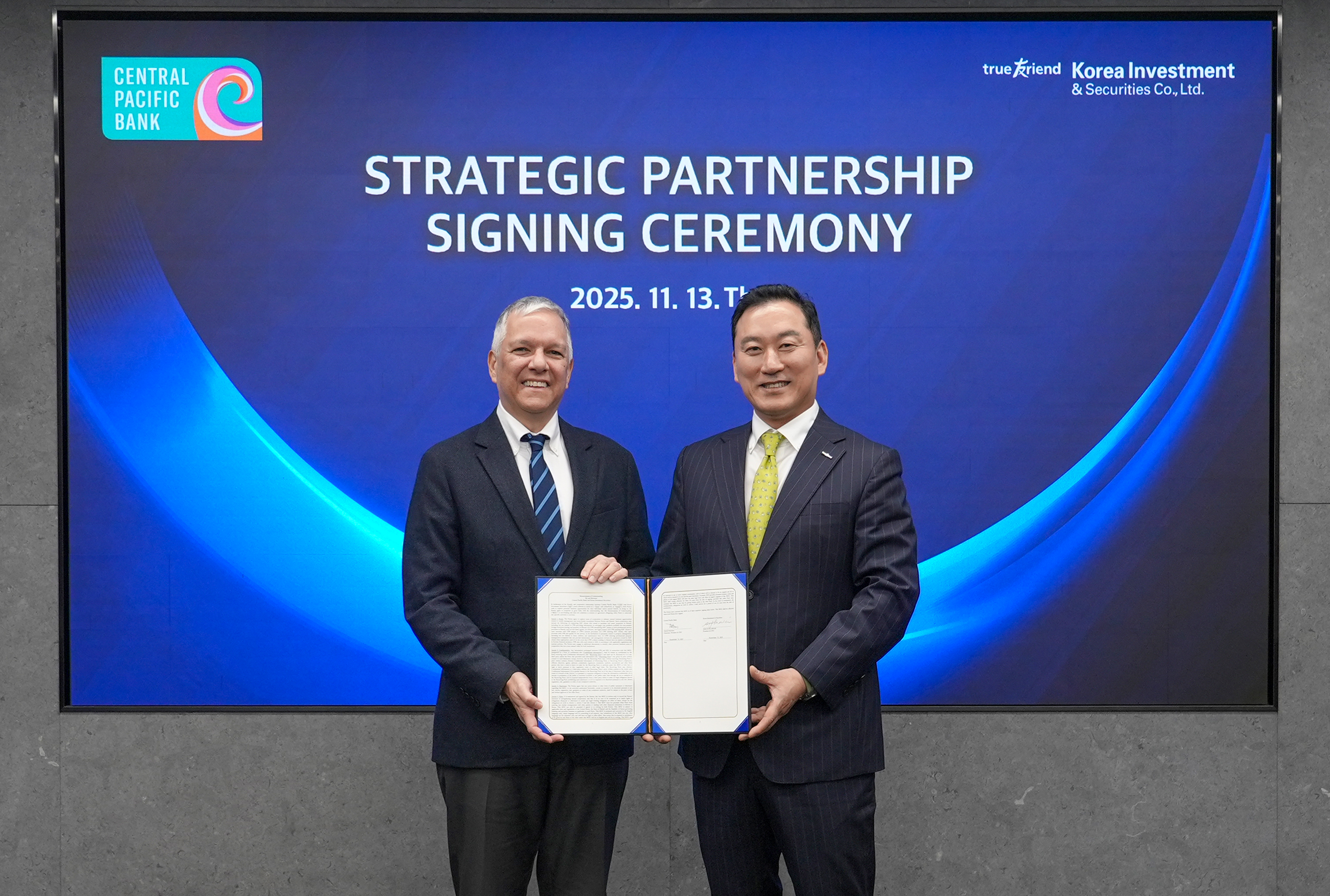 Central Pacific Bank and Korea Investment & Securities leaders hold a signed agreement commemorating a new strategic partnership between the two financial institutions.